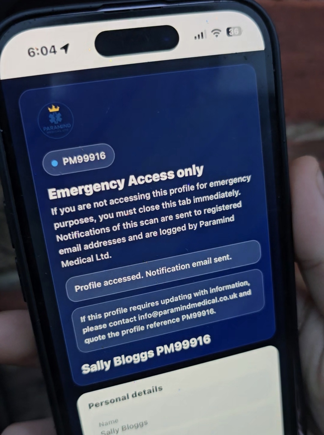 Paramind Medical Lifeline emergency QR profile on a mobile phone, Paramedic-designed secure emergency information for UK families, care homes and supported living